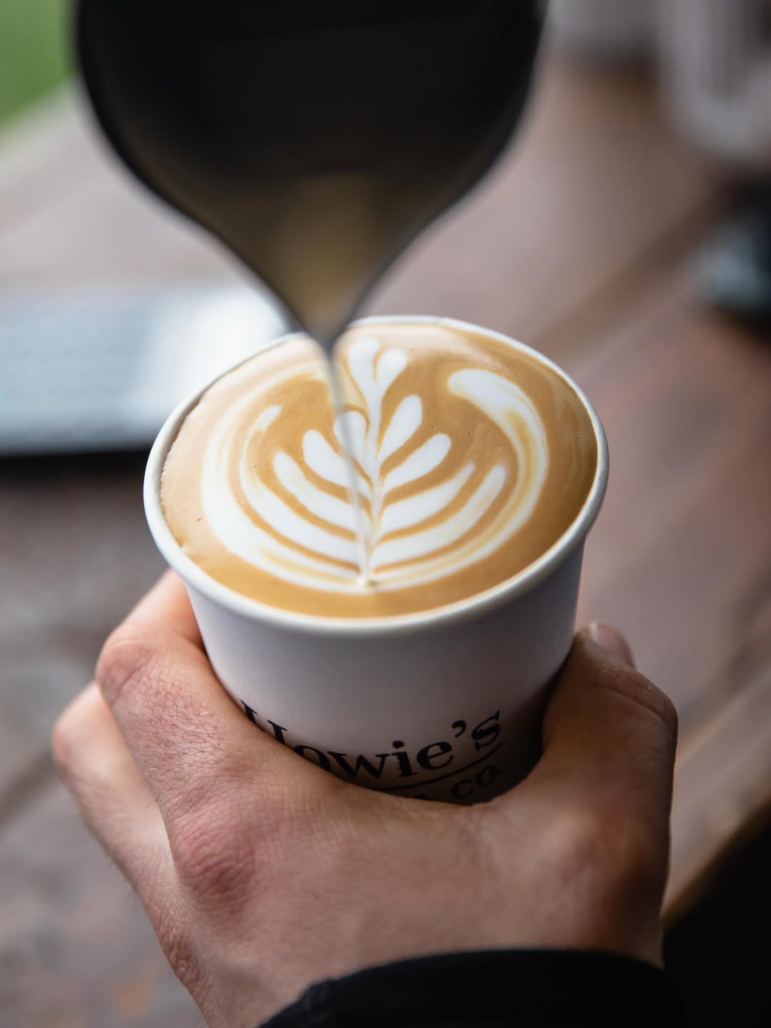 Latte art being poured
